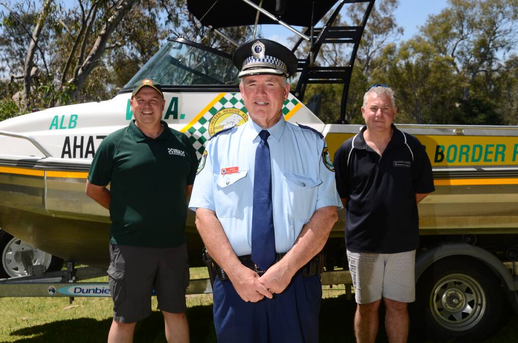 LAUNCH: Inspector Scott Russell, pictured centre with Paul Marshall and Mick Dassey, is urging people to take care on waterways this summer. Picture: BLAIR THOMSON