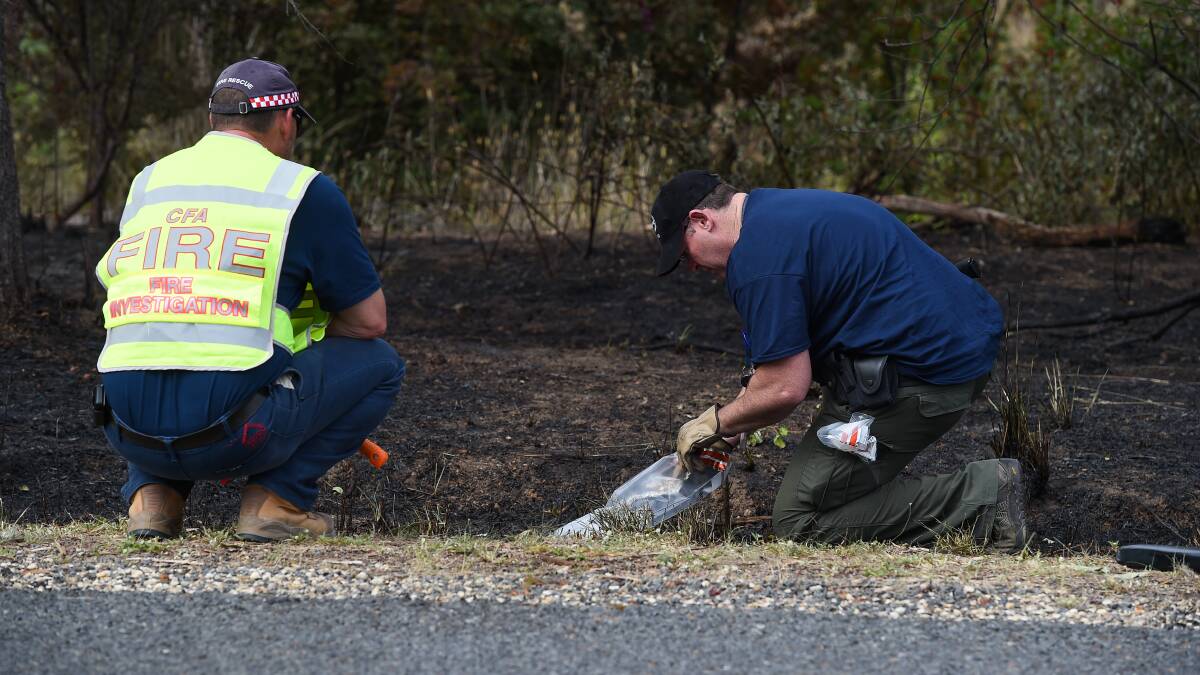 DELIBERATE: Police and fire investigators examined burnt grass and scrub on Old Barnawartha Road two summers ago in one of 20 fires thought to be linked to one person in the Wodonga region. Members of the public are urged to report suspicious behaviour. 