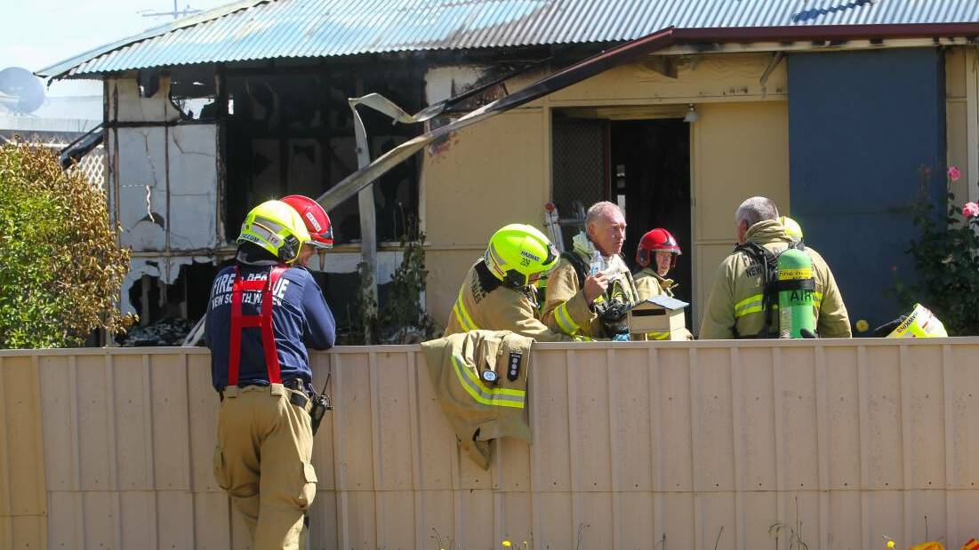 Firefighters at the home after the incident. 