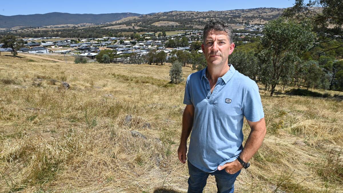 SITE: Concerned resident Rob McCracken on Bears Hill in Wodonga. Telstra wants to install a 35 metre tall phone tower at the site as demand for services in south Wodonga sharply increases. Picture: MARK JESSER