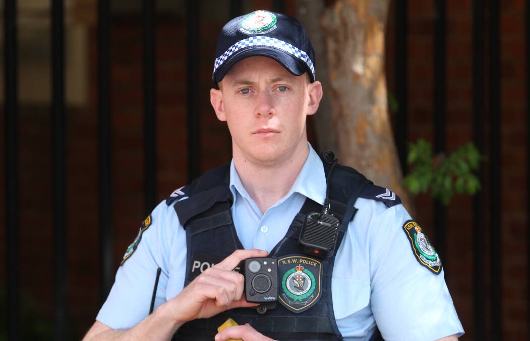 FILMING: Leading Senior Constable Luke Porritt with a body camera outside Albury Police Station on Monday. Picture: BLAIR THOMSON