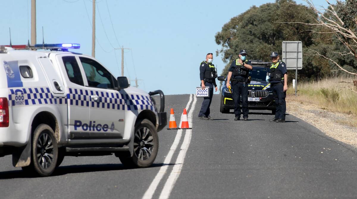 INVESTIGATION: Police examine the scene of the serious crash at Barnawartha. A man was flown to hospital due to the injuries he suffered. It followed a fatal crash at Wangaratta on Friday afternoon. Picture: TARA TREWHELLA
