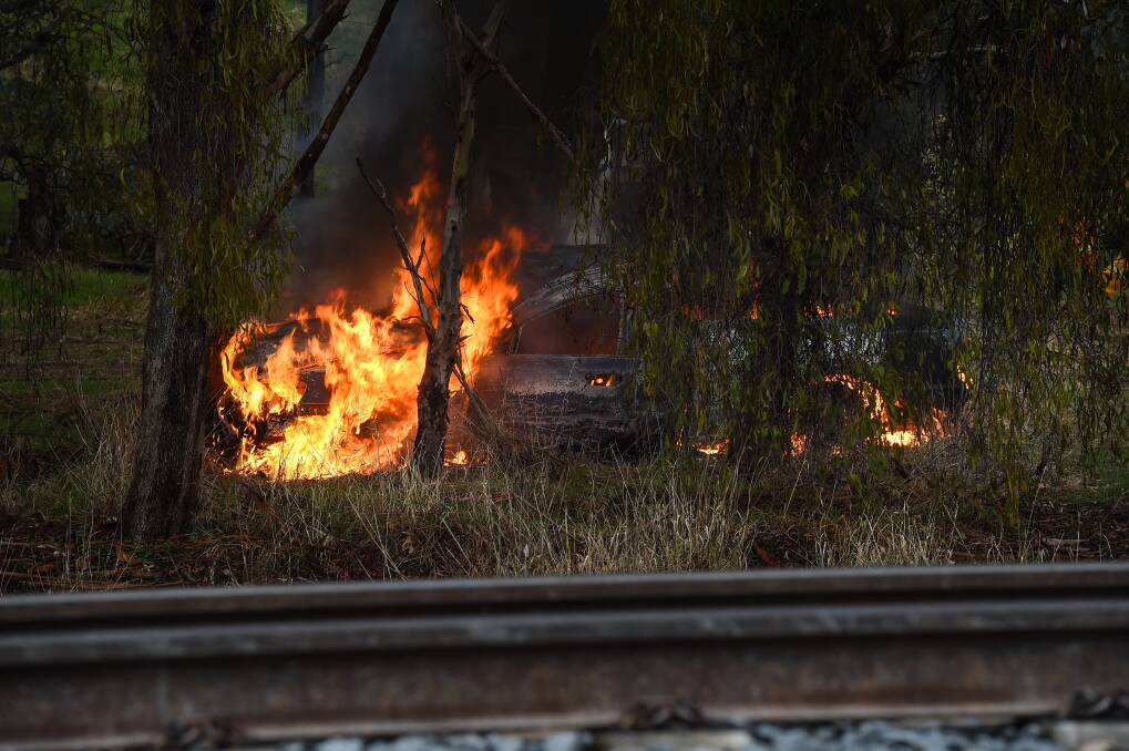 ALIGHT: A stolen vehicle, dumped and set on fire off the Hume Highway recently. 