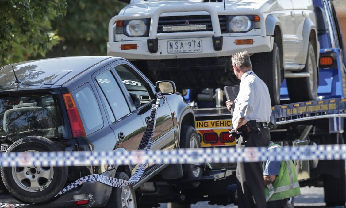 CRIME SCENE: Vehicles are removed from Corowa's Vera Street following the death of Christopher Quirk.