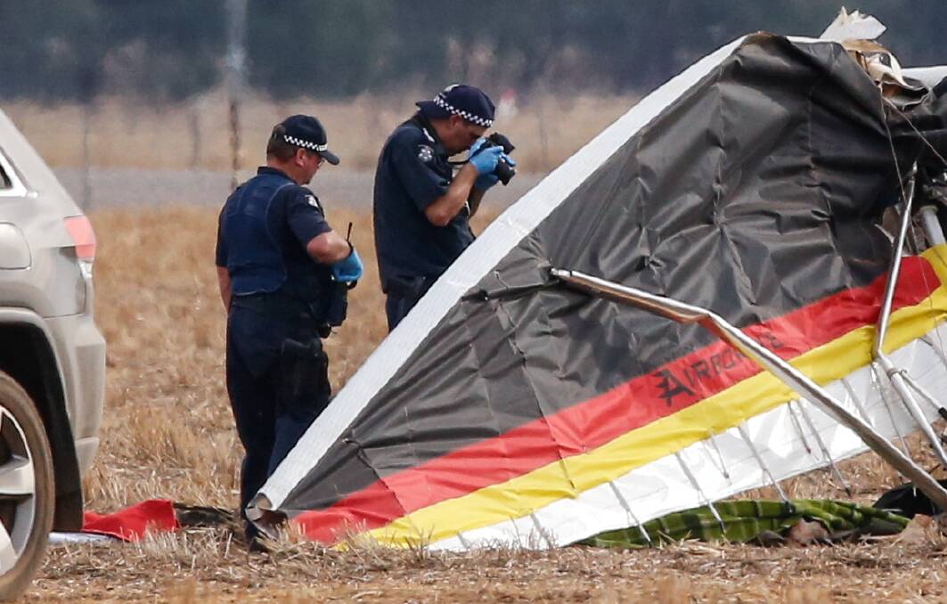 TRAGIC SCENE: Police inspect the plane and its surroundings on March 13, 2016, following the fatal flight which killed two men at Yarrawonga. 