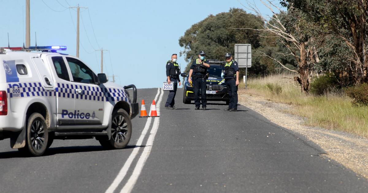 MAJOR CRASH: Police examine the scene of a collision at Barnawartha on Sunday during Operation Compass. The operation will again be run this weekend in a bid reduce the likelihood of similar incidents occurring. 