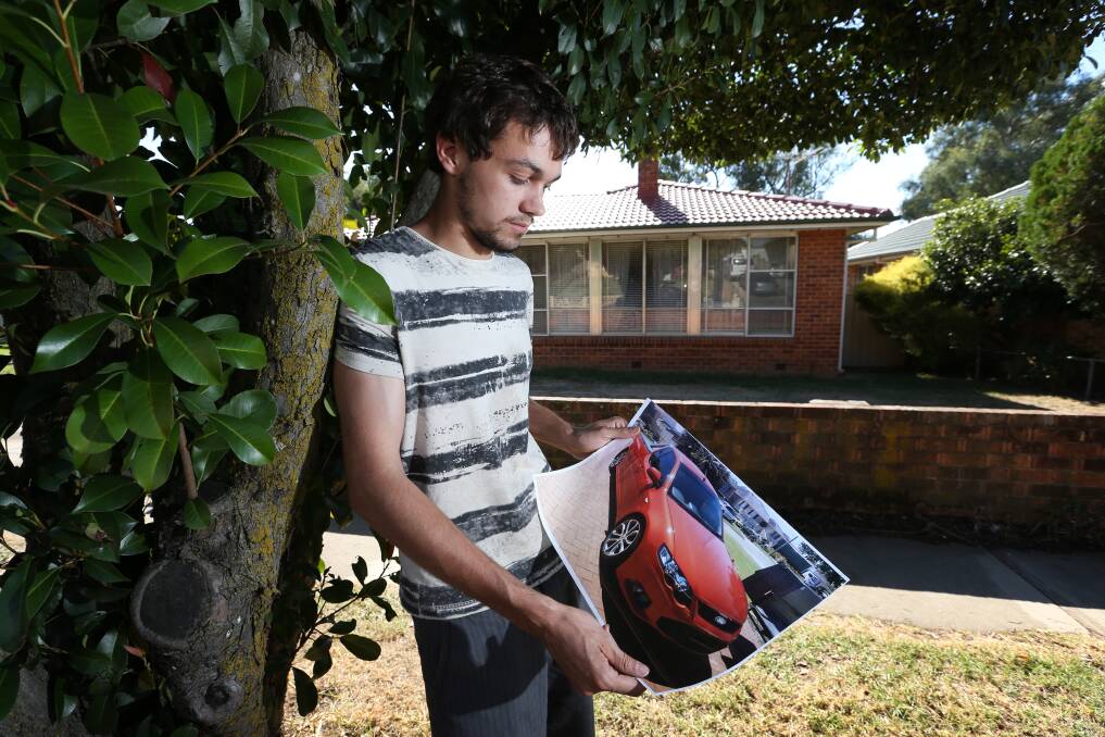 THEFT VICTIM: Corey McDonald, pictured on Christmas Day in 2014, with an image of a ute similar to the one allegedly stolen by Luke Robin. 