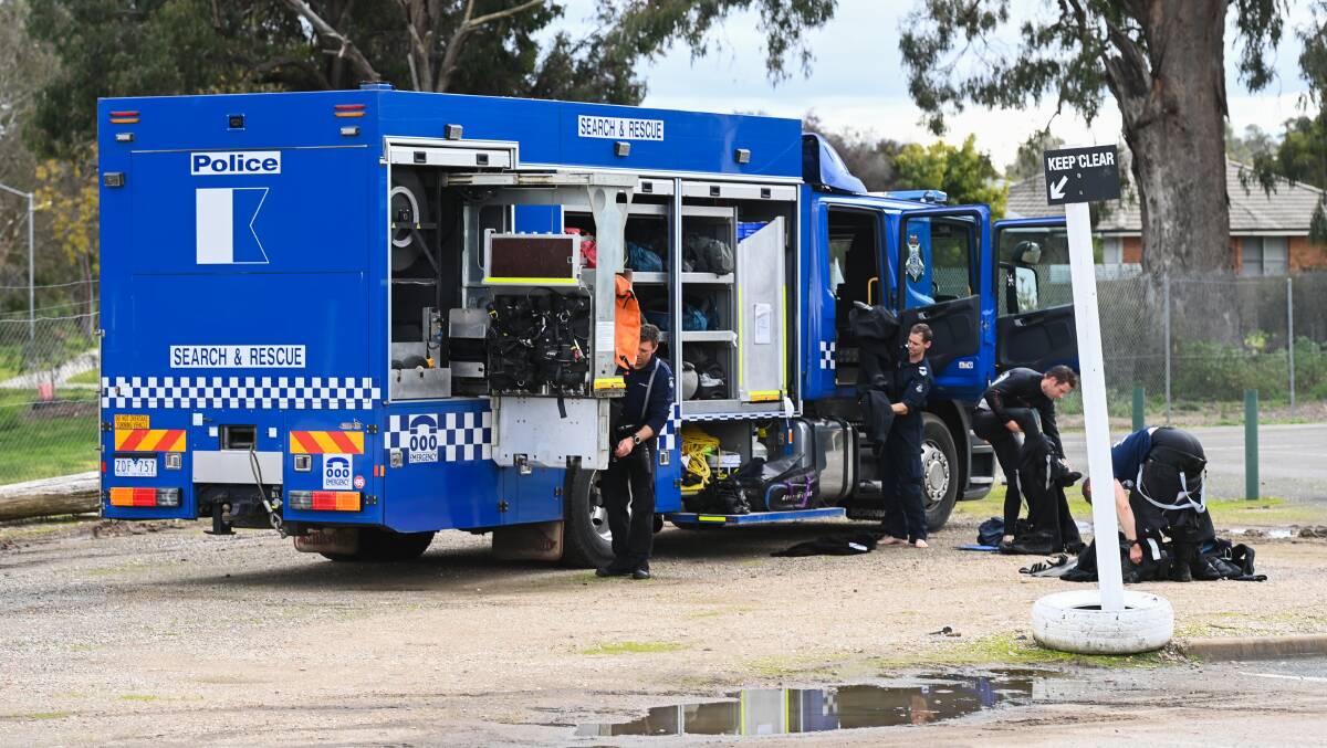 SEARCH: Police divers at the scene of Thursday's operation at House Creek. Picture: MARK JESSER