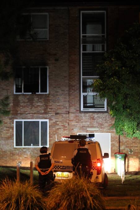 PICTURES: Police guard the unit block after Sunday night's fire. 