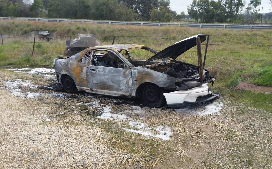 TORCHED: Police are also investigating this car fire at Barnawartha, which occurred on Saturday night. 