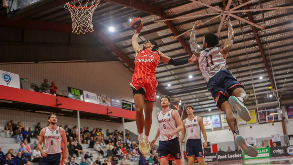 Will 'Davo' Hickey skies for a slam last season against Newcastle. He joins the Bandits from the Illawarra Hawks surging NBL side. Picture by Rob Sheeley