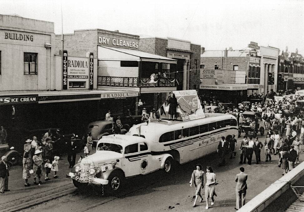 ALL ABOARD: Albury City celebrations in 1947, Murray Valley Coaches' articulated coach in Dean Street. Photo: ALBURY LIBRARY MUSEUM 