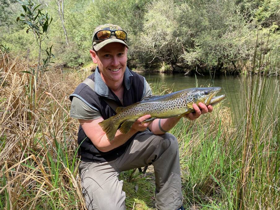STREAM: Ben Mason with a great trout he caught on a Yamamito lure in a local stream. Streams have jumped a tad and have a bit of colour in them after last weekend's rain.