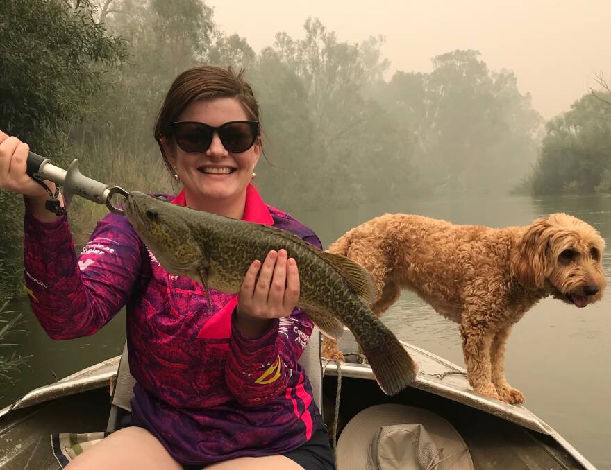 HOOKED: Emily Poynter went out with husband Brad recently on the Murray around Albury and was lucky enough to land this little cod which was released.