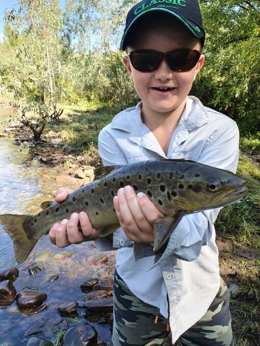 CATCH: Archie Donnelly landed this beautiful 40cm fish on a lure after a few hours fishing on the Mitta. 