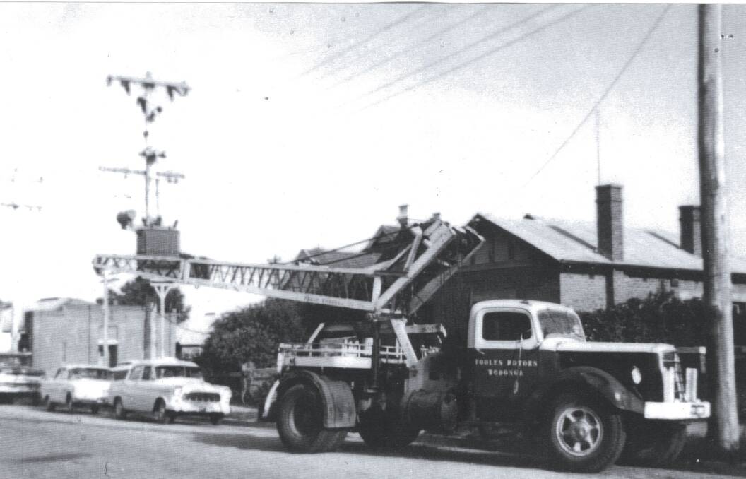 ON CALL: Tooles Mack truck and crane in Stanley Street. Tooles' trucks and drivers provided essential support to police and ambulance during emergencies and accidents. Wodonga RSL in High Street at the left.
