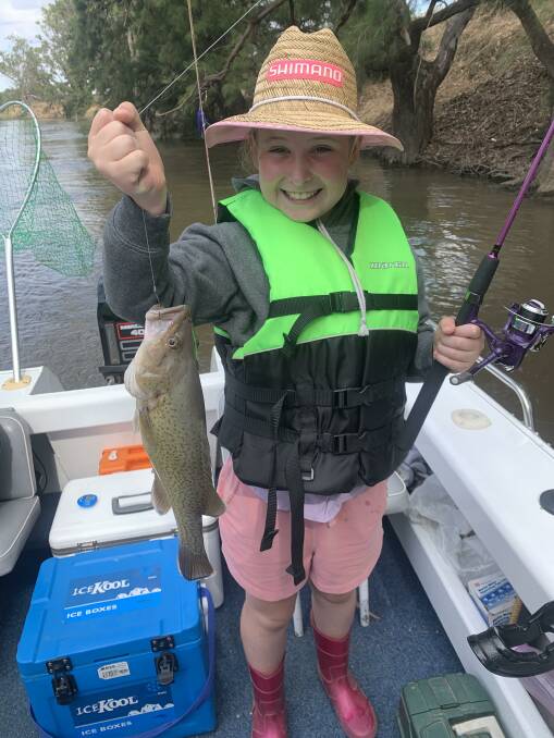 PROUD: Phoenix Fraser, 10, pictured with her 40cm cod caught in Murrumbidgee River.