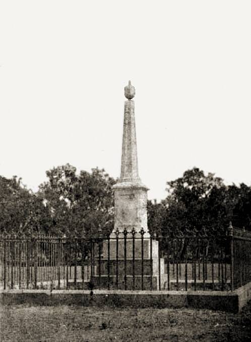 MONUMENT: The Hume Monument with iron railings before its removal to the Botanic Gardens in 1884.