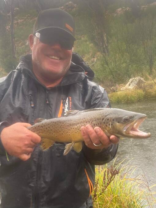 SOLID CATCH: Leif Wikman with a solid trout from the Eucumbene River spawning run. Photo: SUPPLIED