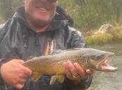 SOLID CATCH: Leif Wikman with a solid trout from the Eucumbene River spawning run. Photo: SUPPLIED