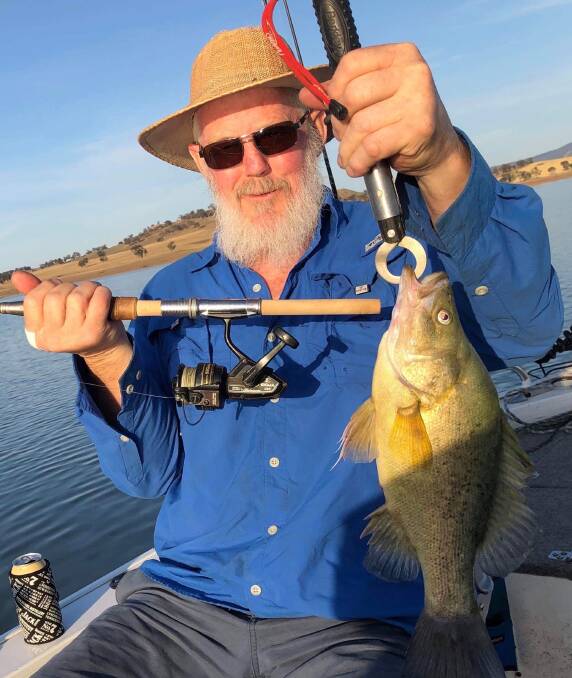 TROLLING: Garry Poynter, with a yellow belly he trolled during the week. The past week has seen patchy results across the region.