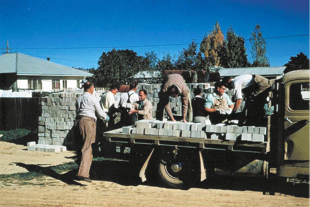 COMMUNITY: Members of the community pictured unloading bricks for the Wodonga swimming pool.