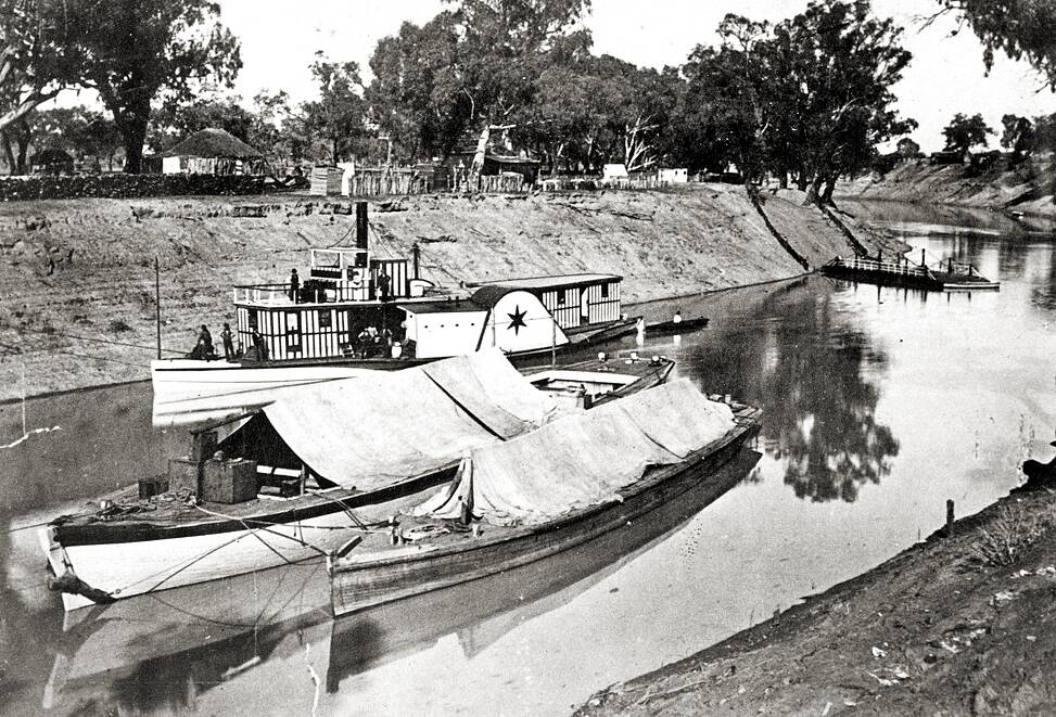 ABOARD: The PS Cumberoona on the Darling River with unique striping on its cabins and upper deck and a large star adorning the paddle wheel cover. Photo: State Library of South Australia