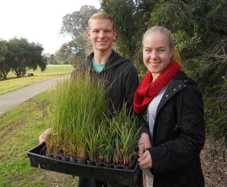 PLANTING: Cameron and Erin McIntosh are armed and ready for National Tree Day. Both are members of the Friends of Willow Park group. The Wodonga event will be staged on Sunday, July 31.