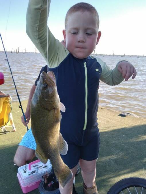 CATCH RELEASE: Thomas Cato, 5, caught this cod last weekend at Mulwala before setting it free.