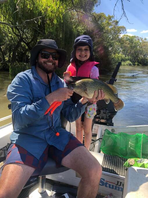 PROUD: Eliza McGregor, 5, landed and released her first Murray Cod at Howlong, caught on cheese. Santa gave her a new rod for Christmas. Dad Scott was very proud.