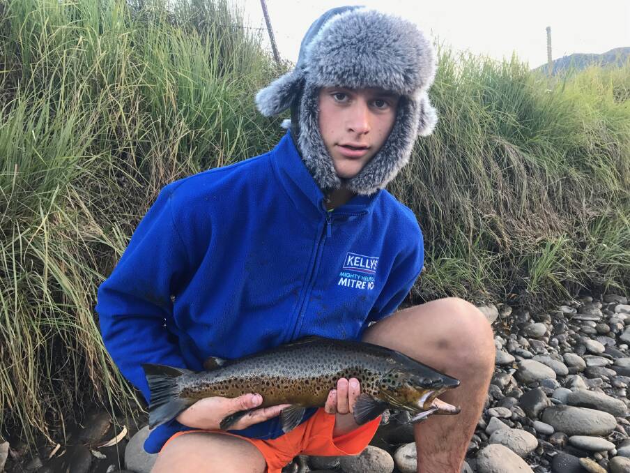 ON TARGET: Jack Hudson with a 57-centimetre brown trout, caught on a five-centimetre Bullet Lure on the Upper Murray.