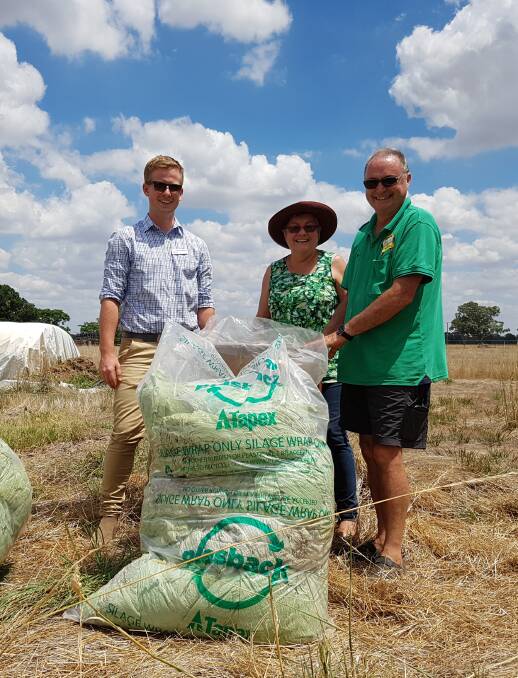 SUSTAINABLE: Holbrook Landcare's Thomas Carberry and Kim and Ken Hulme with silage wrap being recycled.
 