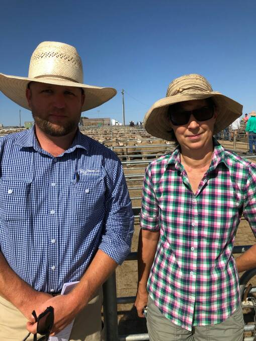 MARKET WATCH: Adam Roberts from Rodwells with Judy Jackel, of Corowa, watch the family lambs sold that made $114.00.