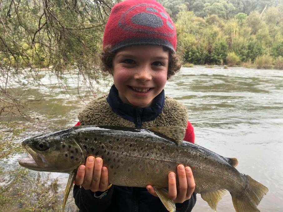 PROUD: Lennox Humphries shows off his catch during a fishing trip near Tumut.