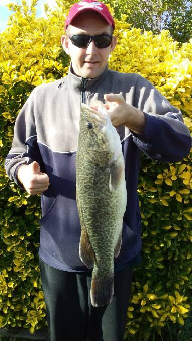 NICE ONE: Keen angler Trent Jackson, with a 60cm cod caught near Yarrawonga.
