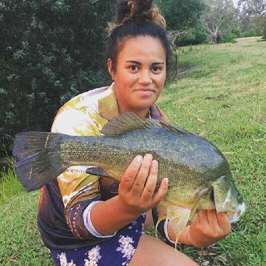 HOOKED: Jasmine Morunga shows off the yellowbelly she caught in the Murray River at Albury.