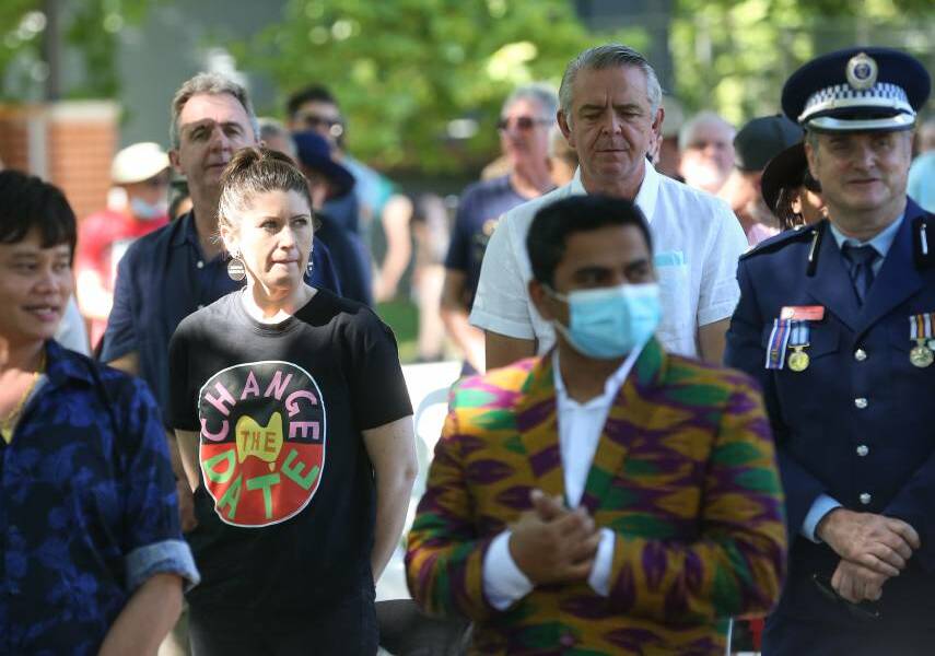 Frank Zaknich stands next to a senior police officer at Albury's 2022 Australia Day ceremonies with councillor Ashley Edwards donning a T-shirt making her opinion on the date of the national day clear. Picture by James Wiltshire