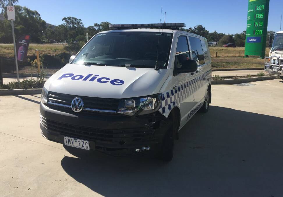 Copped a blow: This police crime scene van was damaged on its front passenger side and needed to be towed away from the service station.