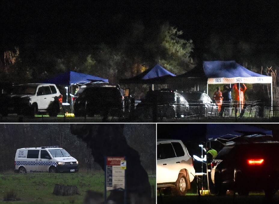 On the scene: Police examine the Murray River camping spot where two men were shot on Wednesday. Pictures: MARK JESSER