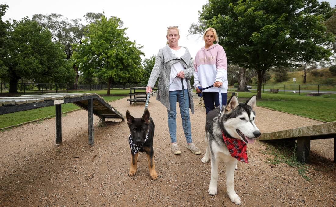 Bernice Ritchie with Levi and Olivia Missio with Charlie at Belvoir Dog Park, Ms Ritchie said it was traumatic to return to the park after her near dog attack incident. Picture by James Wiltshire