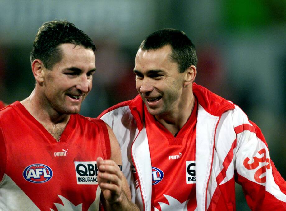 Swans champions Daryn Cresswell and Paul Kelly in their playing days.