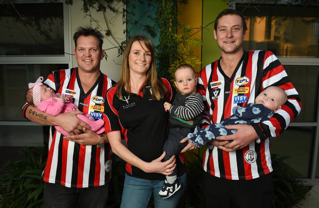 LITTLE SAINTS: Matt Turvey with Scarlett, four weeks, Stacey Neumeyer with Felix, one, and Cameron Gilcrist with Brody, 10 weeks. Picture: MARK JESSER