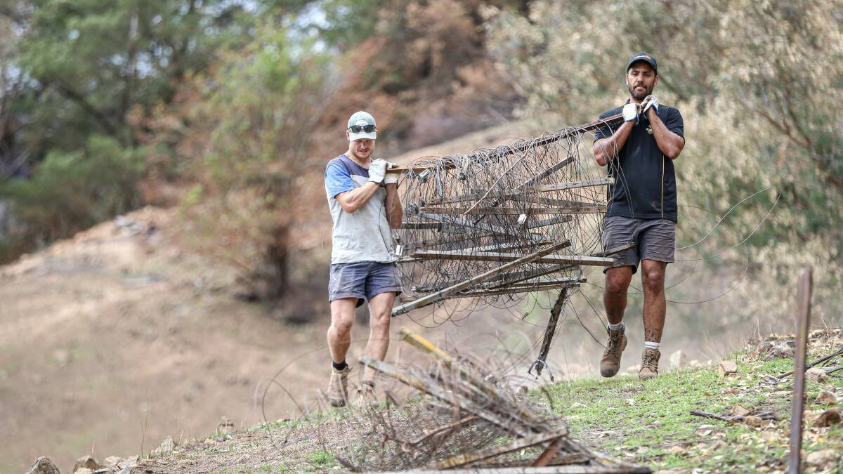 GALLERY: Albury players spent Saturday afternoon fencing in the Upper Murray. (There is no suggestion the players in these pictures were among those causing the disturbance on Saturday night). Pictures: JAMES WILTSHIRE