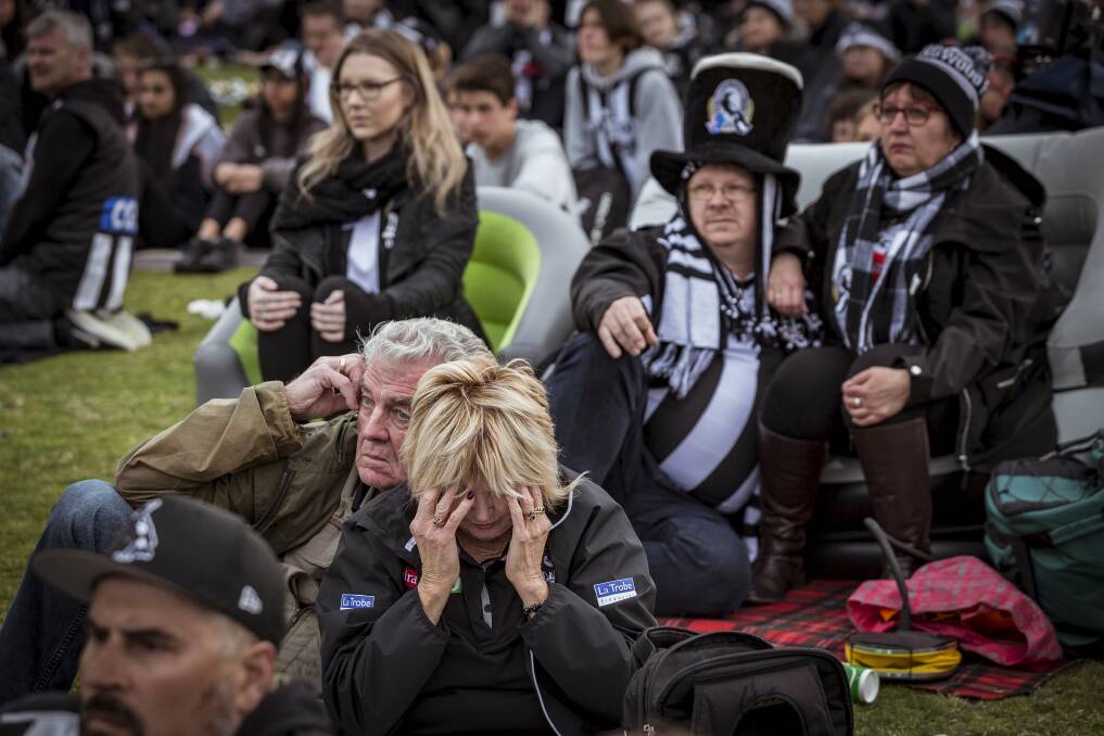 Collingwood fans feel the pain of defeat on Saturday. Picture: CHRIS HOPKINS