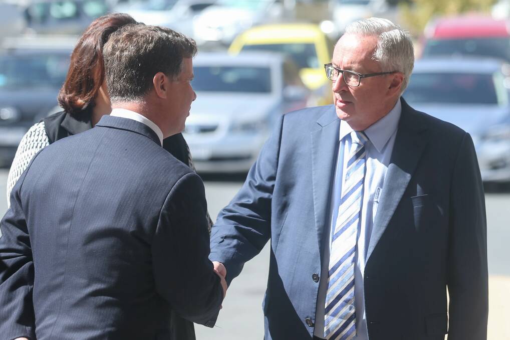 Albury MP Justin Clancy shakes hands with NSW Health Minister Brad Hazzard in Albury last week. Picture: TARA TREWHELLA
