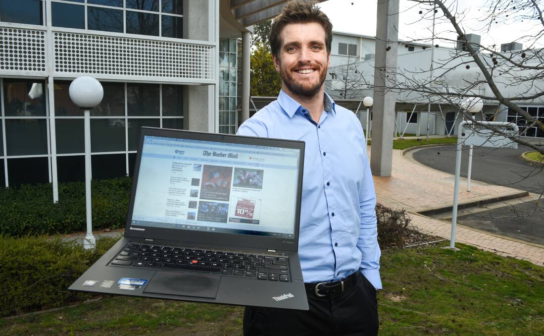 REFRESH: Editor Xavier Mardling shows off The Border Mail's new-look website, which makes it simpler to get your favourite local news on the go. Picture: MARK JESSER