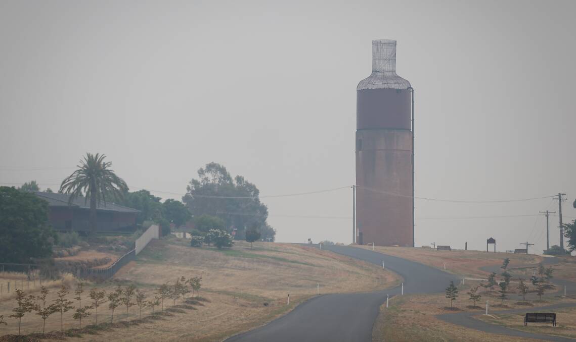 Rutherglen's wine bottle was a little more difficult to see on Tuesday with smoke covering the North East region. Picture: JAMES WILTSHIRE