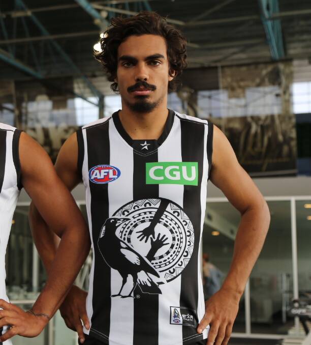 Tony Armstrong models an Indigenous round jumper during his time at Collingwood.