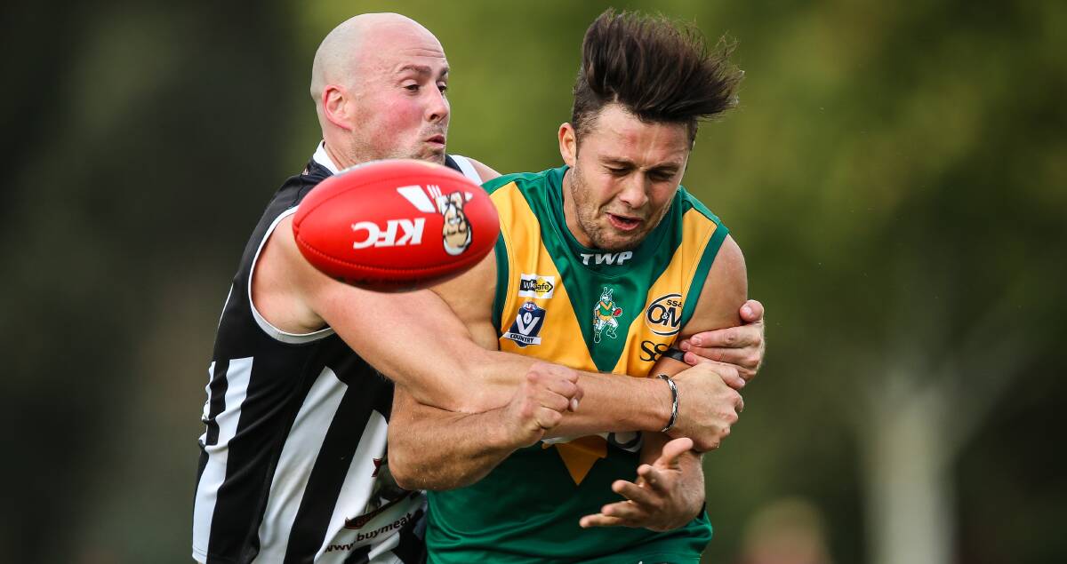SLICK: North Albury spearhead Ricky Whitehead, who kicked eight goals, is spoiled by Magpie defender David Thayer. Picture: JAMES WILTSHIRE