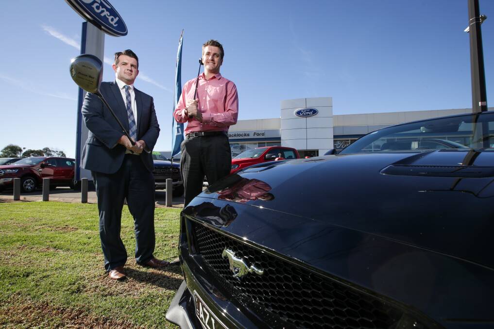 PRIZED DRIVE: Blacklocks Ford dealer principal Michael Dixon and Border Mail editor Xavier Mardling with the convertible GT Mustang. Picture: JAMES WILTSHIRE